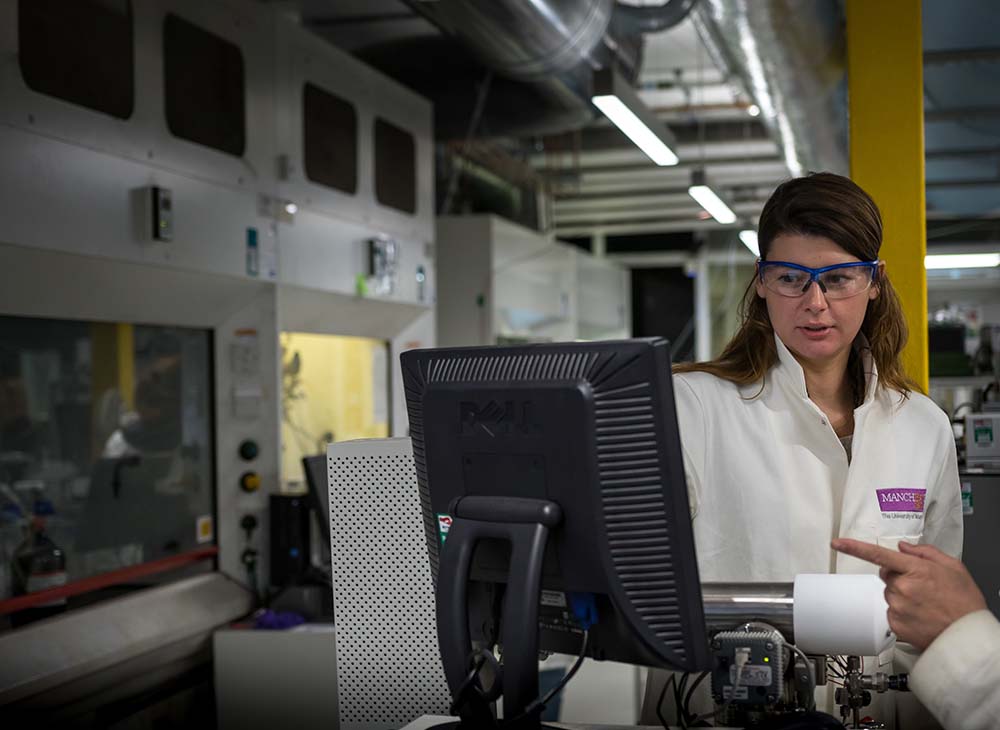 Image of student looking at computer in laboratory.