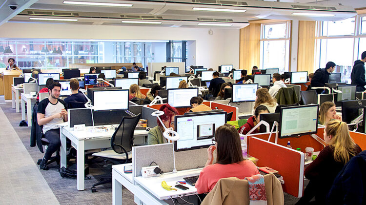 Classroom with multiple computer workstations.