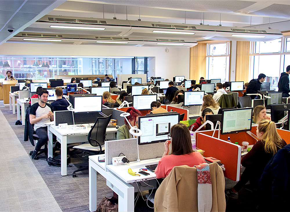 Classroom with multiple computer workstations.